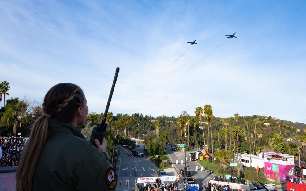 U.S. Air Force Capt. Sarah Brandt uses a land mobile radio to communicate with aircrew of two B-1B Lancers at the Rose Parade.