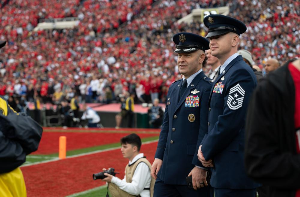 U.S. Air Force Col. Joseph Sheffield and Chief Master Sgt. Keelan Rasmussen (right), watch the 109th Rose Bowl Game. 
