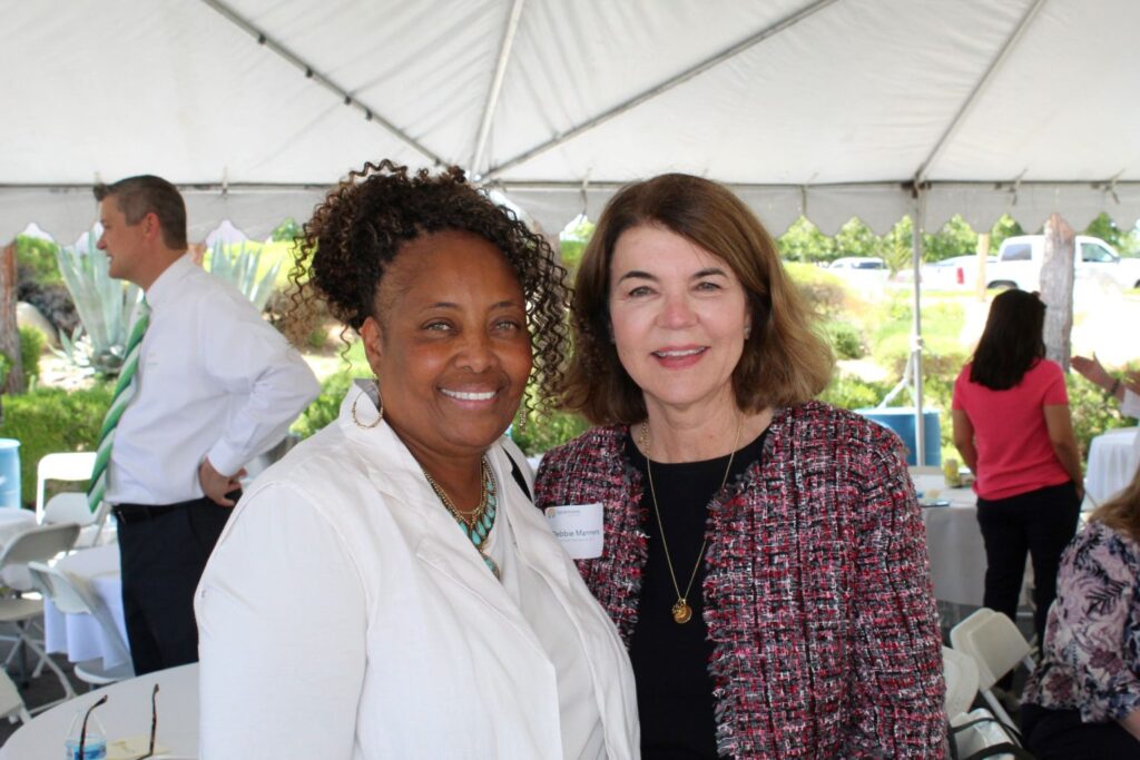 Theion Perkins, LA County Department of Mental Health, with Sycamores’ Debbie Manners.